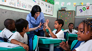 teacher with students in international classroom