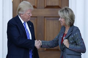 Trump and DeVos shake hands