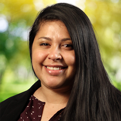 Mayra Alvarado smiling, looking at camera