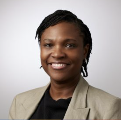 African American female educator smiling in a head shot.