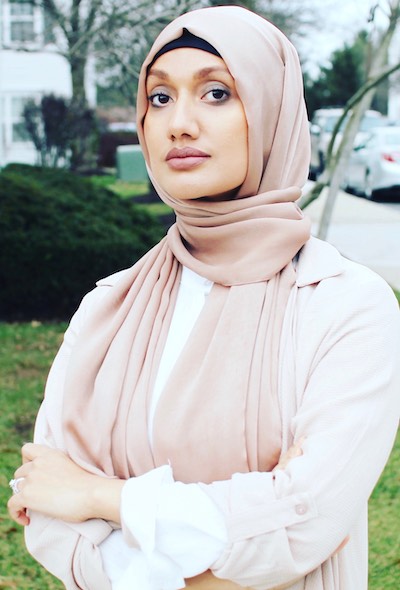 Nazma Khan, outside, wearing pale pink hijab