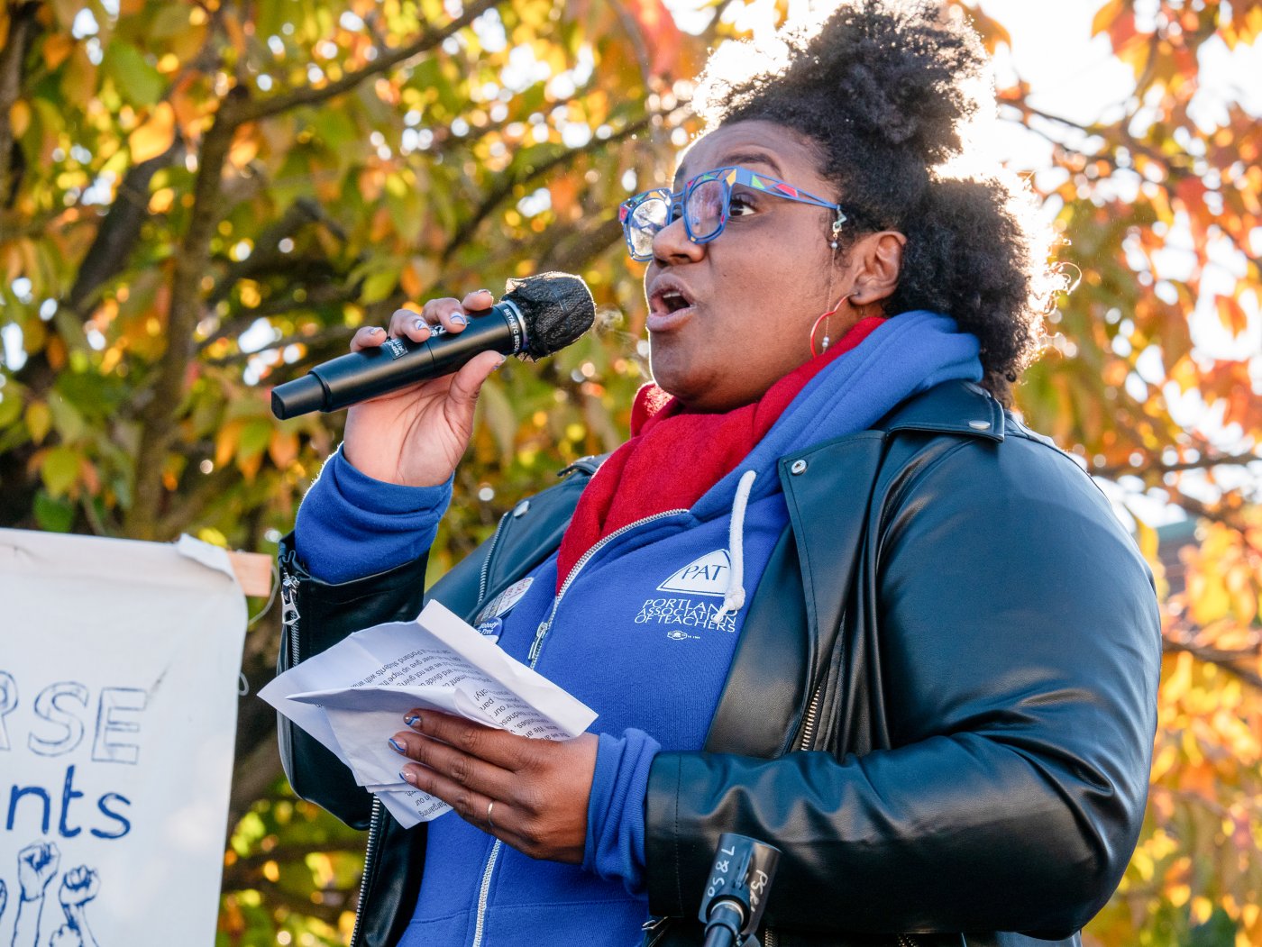 Photo of Angela Bonilla with microphone