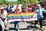 Carol Watchler (left) leads the Pride Parade in Princeton, N.J.