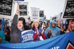 Portland pro-education protesters picketing with signs.