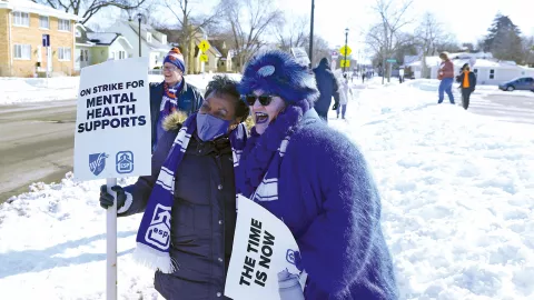 NEA President Becky Pringle outside with Brionna Harder in Minneapolis at protest by educators