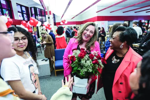 Becky giving educator roses