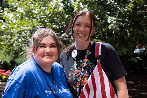 Two Aspiring Educators stand together smiling.